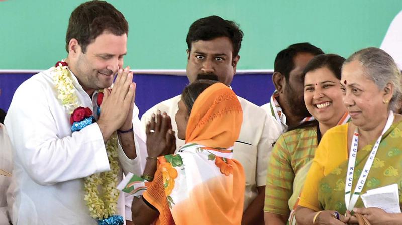 Congress President Rahul Gandhi greets a woman during the partys rally at Godachi in Belagavi district on Monday. Senior party leader Margaret Alva is seen. 	(Photo:KPN)