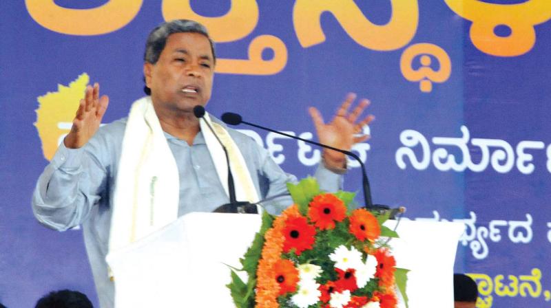 Chief Minister Siddaramaiah speaks after inaugurating Shakti Sthala, the worlds largest solar park, at Thirumani in Pavagada taluk on Thursday