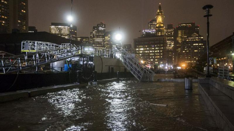 In Boston and nearby coastal communities, storm surges and high tides sent seawater in the streets, the second floods there this year. (Photo: AFP)