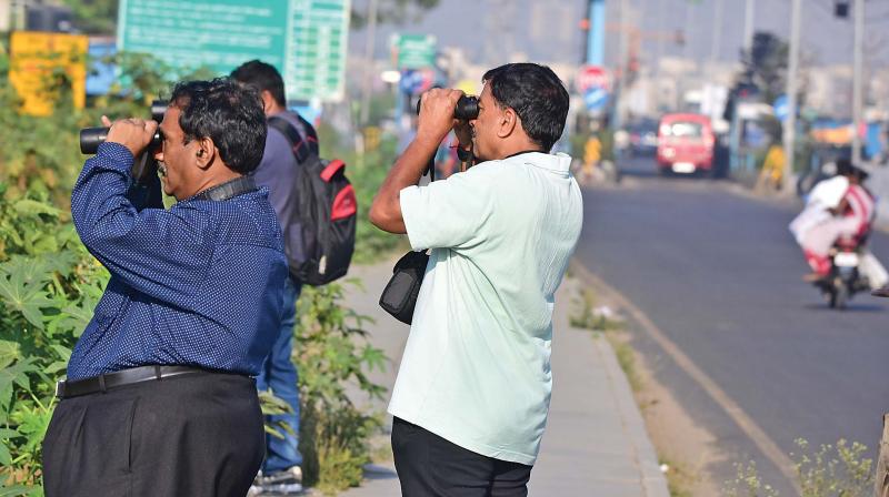 Suresh (left), Shankar watching the birds at Pallikaranai.	(Photo:DC)