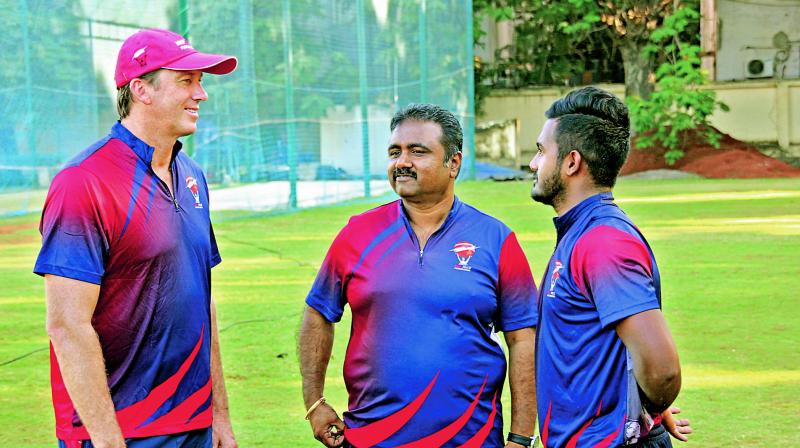 Glenn McGrath (left) interacts with MRF Pace Foundation trainee K.M Asif (right).