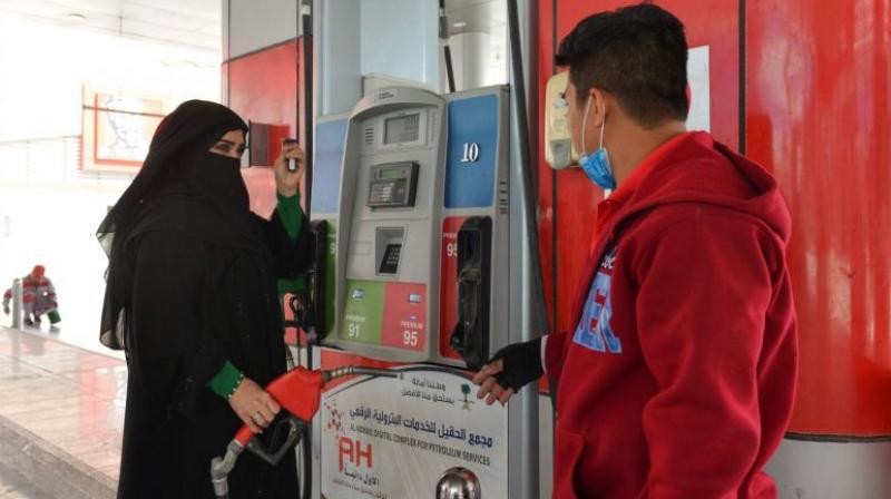 Mervat Bukhar become the first Saudi woman to work at a gas station, something unimaginable not long ago. (Photo: AFP)