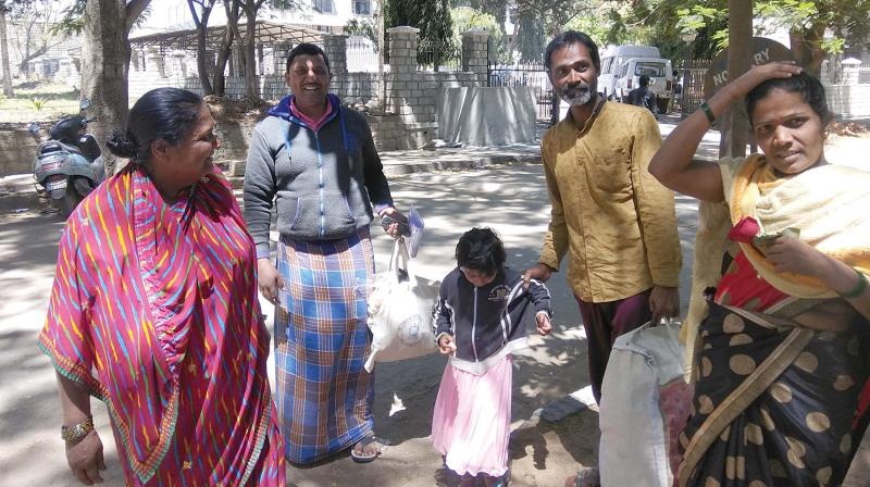 Veeranna (2nd R) walks out of Parappana Agrahara along with his younger brother Ajay and other family members on Wednesday