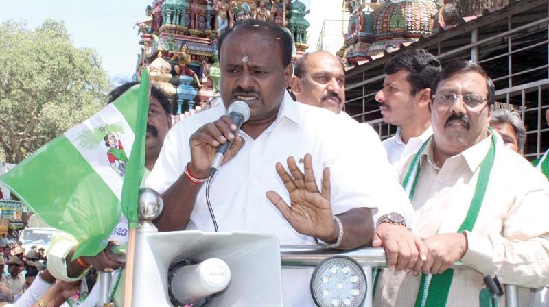 JD(S) state president and former CM H.D. Kumaraswamy participates in a road show at Jayanagar in Bengaluru on Wednesday