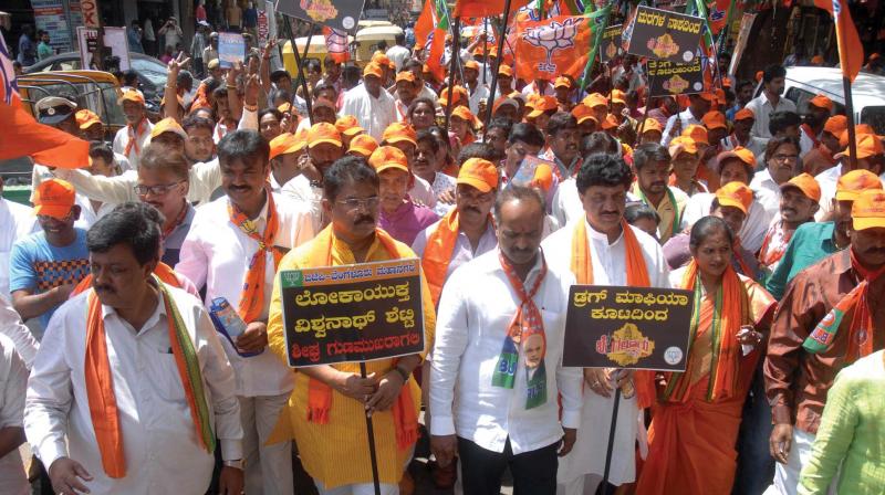 BJP leaders take out a procession as part of their Save Bengaluru rally in Bengaluru on Friday.  (Photo:DC)