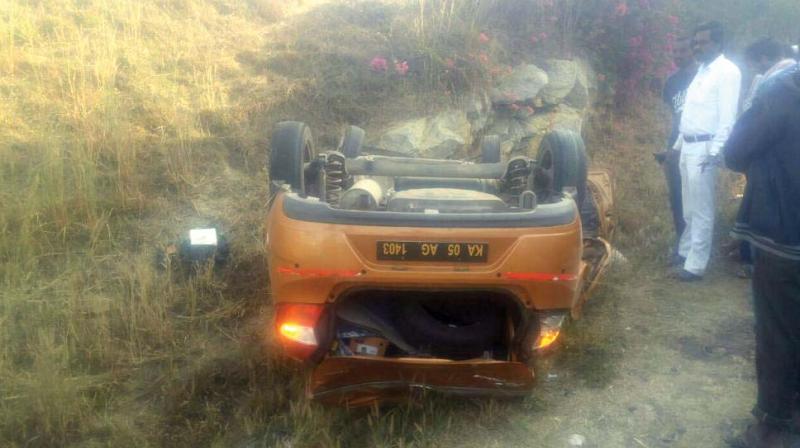The car that overturned, killing three students on board on NICE Road in Bengaluru on Friday. (Photo:DC)