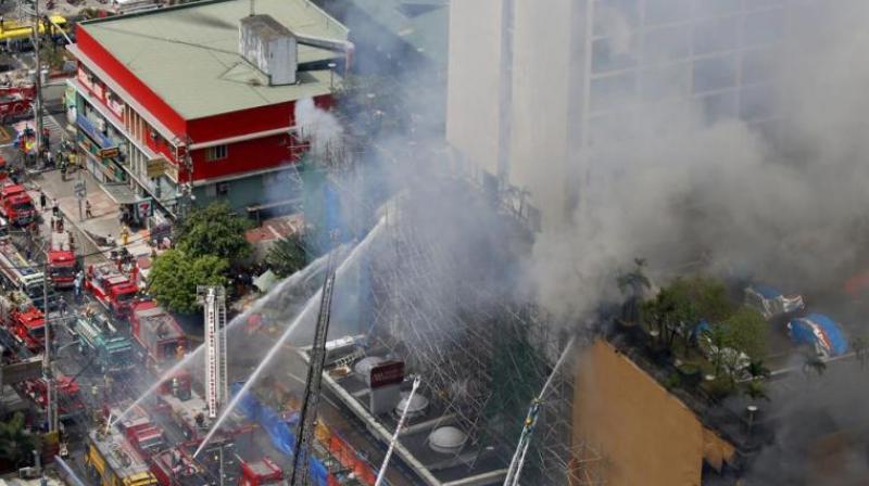 The blaze at the Waterfront Manila Pavilion, a hotel and casino complex, was still raging six hours after it began on Sunday morning, prompting more than 300 people to flee the area and six to be brought to hospital, fire and city officials said. (Photo: AP)