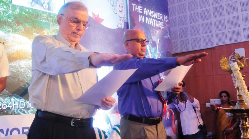Governor P. Sathasivam and additional chief secretary Tom Jose take the World Water Day pledge during the state-level inuguration of the event in Thiruvananthapuram on Thursday.  (Photo:A.V.MUZAFAR)
