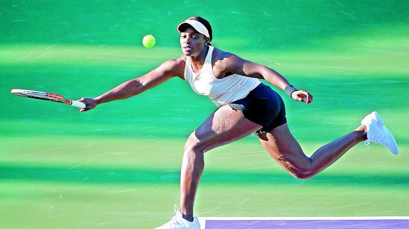Sloane Stephens returns a shot from Ajla Tomljanovic of Australia during their second round match at the Miami Open on Thursday in Key Biscayne. Stephens defeated Tomljanovic 6-1, 6-3. 	 (Photo:AP)