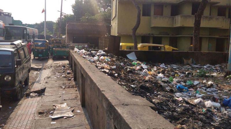 Garbage lies unattended on Subramanyapura Road in Banashankari