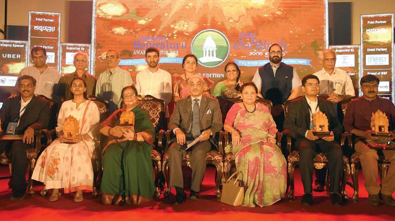 Winners of Namma Bengaluru Awards (NBA) 2018 with Justice (Retd.) Swatatra Kumar (seated middle), Rajya Sabha member Rajeev Chandrasekhar (second from right, standing) and MLC Tara Anuradha (fourth from right, standing)