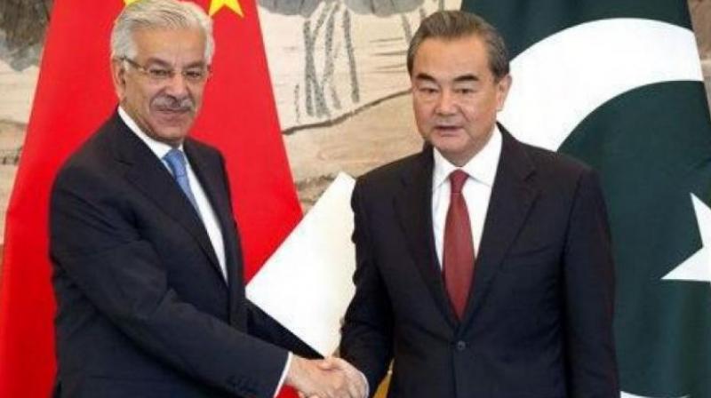 Pakistans Foreign Minister Khawaja Muhammad Asif (left) and Chinese Foreign Minister Wang Yi. (Photo: AP/File)