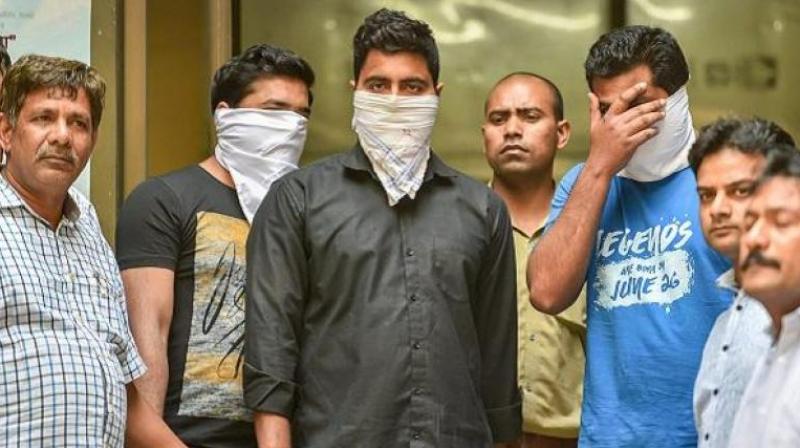 With the arrest of three men, including two teachers of a private school in Bawana, police claimed to have busted a module in which the teachers had shared WhatsApp images of the Economics paper one-and-a-half hours prior to the exam. (Photo: PTI)