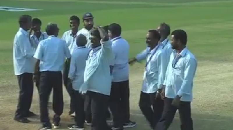 The Indian opener, Murali Vijay, won hearts as he hugged the member of the ground staff to appreciate the hard work they put in to maintain ground in the wake of Cyclone Vardah. (Photo: Screengrab)