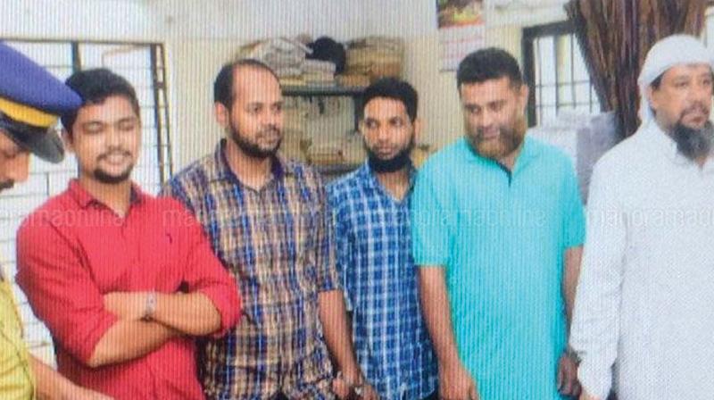 The five men accused of links with IS before they were produced at sessions court at Thalassery on Tuesday.