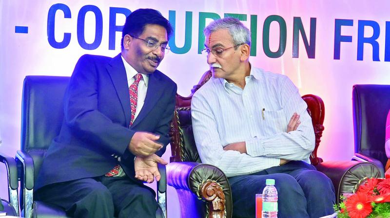 Chief Vigilance Commissioner K.V. Chowdary (right) interacts with Principal Chief Commissioner of Income Tax department S.P. Choudhury while addressing Vision  Corruption Free India as a part of Vigilance Awareness Week at the Amaravathi Aditorium, Income Tax Guest House, Banjara Hills on Friday.  (Photo: DC)