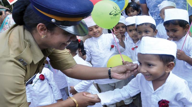 A woman cop with a child during the rally held as part of the opening ceremony of children-friendly police station at Kadavanthra on Tuesday. (Photo: SUNOJ NINAN MATHEW)