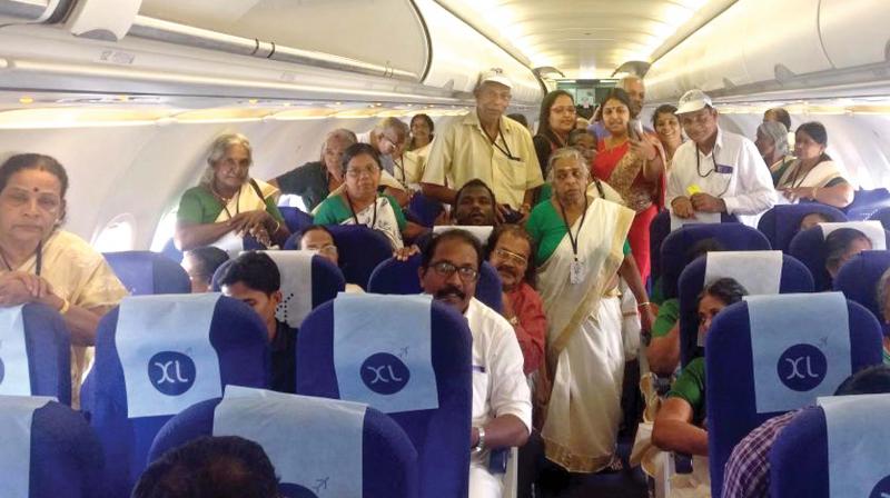 Team of 46 senior citizens inside the flight aisle during their trip from Kochi to Thiruvanantha-puram as part of geriatric tourism inititive under Age-Friendly Ernakulam programme. (Photo: DC)