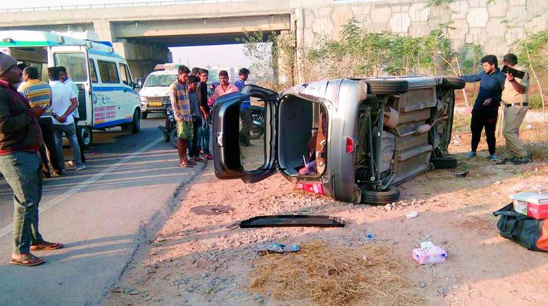 The car which toppled after it was hit by a lorry at Ghatkesar on Friday morning.