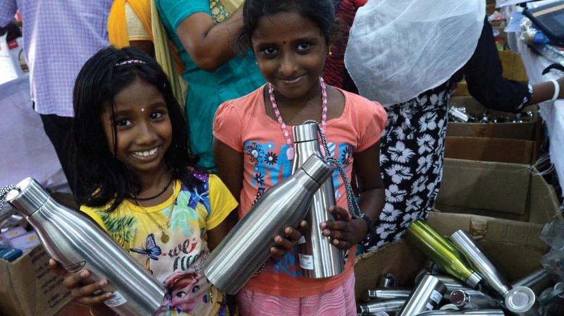 Children shop steel water bottles in city on Tuesday.