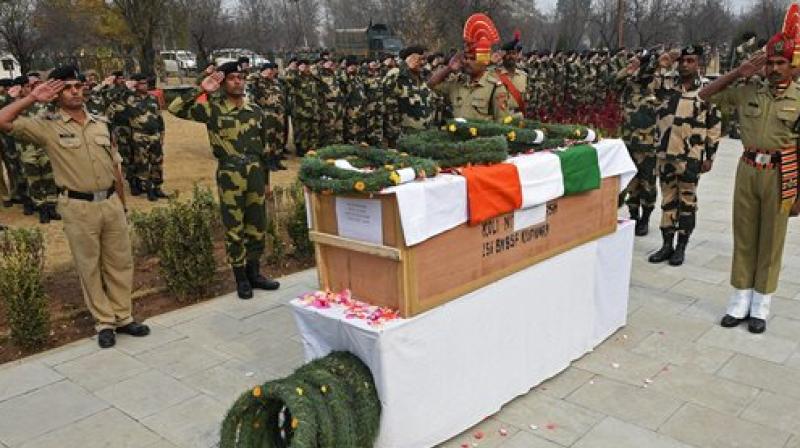 BSF personnel salutes at the coffin of Constable Nitin Subhash, who was killed last evening when an explosion inside the chamber of the long range weapon led to reciol while he was firing in retaliation across the LoC in Machil. (Photo: PTI)