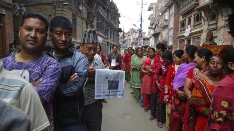 Nepalese stand in a queue to cast their votes at a polling station during the local election in Bhaktapur, Nepal, on May 14. (Photo: AP)