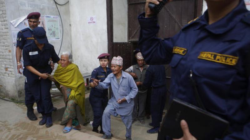 Nepalese elderly people arrive at a polling station to cast their votes during the local election on May 14. (Photo: AP)