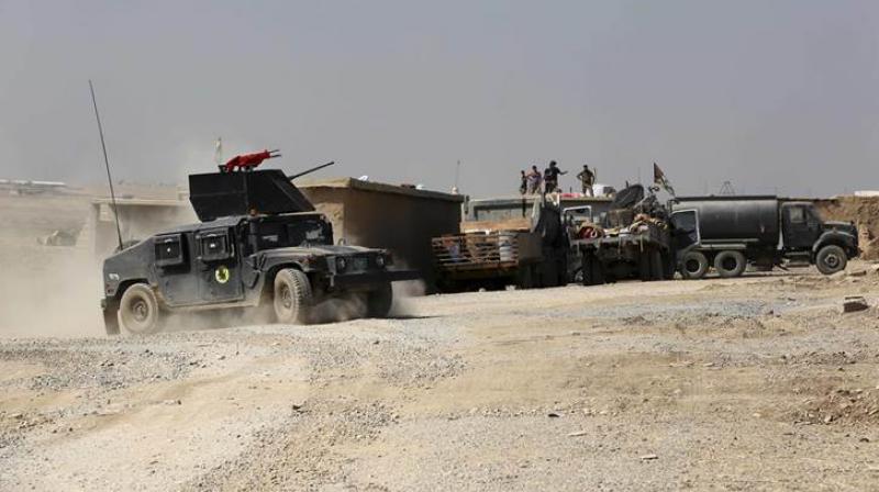 Iraqi forces are deployed during an offensive to retake Mosul from Islamic State militants outside Mosul, Iraq. (Source: AP Photo)