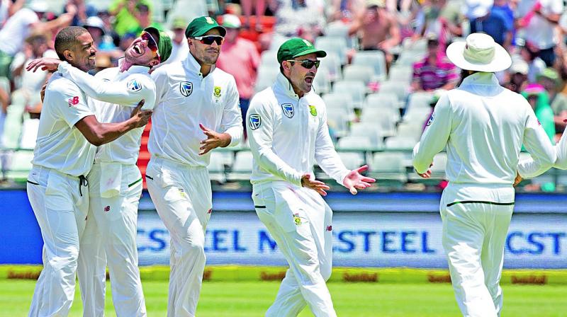 South Africa celebrate an Indian wicket on day two of the first Test at Cape Town (Photo: AP)