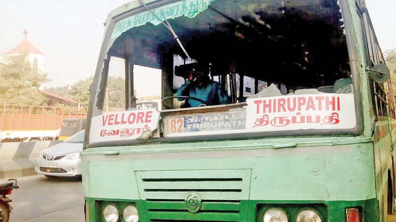 Protesters attacked a government bus with stones and damaged the windscreen of the bus near Katpadi on Saturday. (Photo: DC)