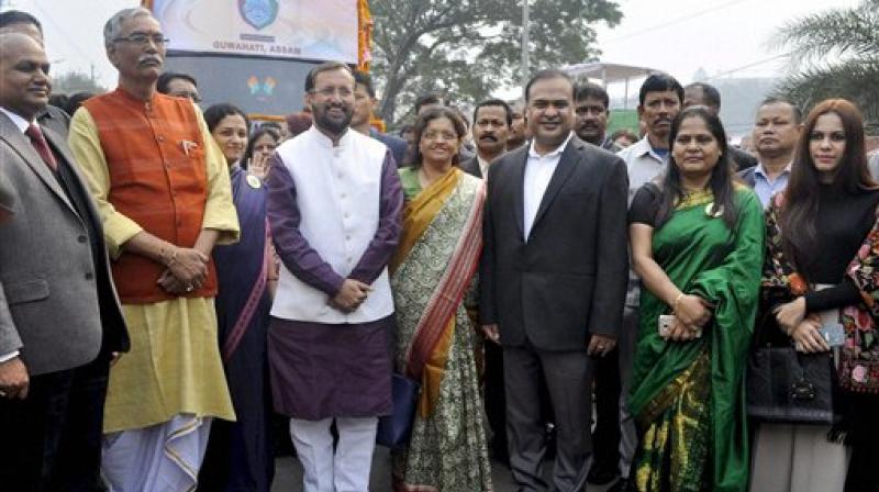 HRD Minister Prakash Javadekar with Assam education minister Himanta Biswa Sarma, Rita Chowdhury Director of National Book Trust and others flagging off the Brahmaputra Literary Festival 2017 cultural rally in Guwahati. (Photo: AP)