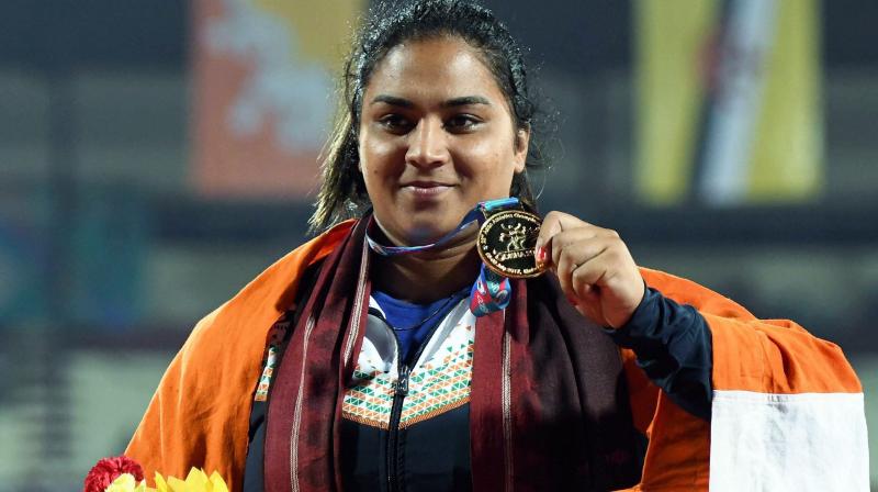 Indias gold medalist Manpreet Kaur shows her medal during the presentation ceremony of the Womens Shot Put event during the 22nd Asian Athletics Championships in Bhubaneshwar, Odisha on Thursday. (Photo: AP)