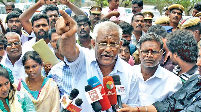 Retired SI Selva Azhagu interacts with the press near Fort St George, before he was whisked away. (Photo: DC)