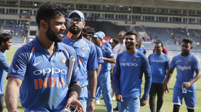 Indias captain Virat Kohli leads his team off the field after beating West Indies for 8 wickets during their fifth ODI at the Sabina Park cricket ground in Kingston, Jamaica, Thursday, July 6, 2017. India won the series 3-1. (Photo: AP)