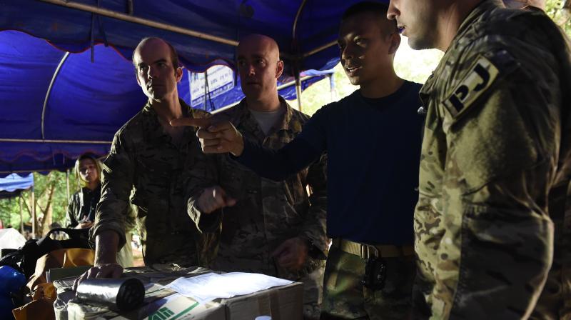 US forces and British divers have arrived in Thailand to help in the search for 12 schoolboys and their soccer coach believed trapped by floodwaters in a cave. (Photo: AFP)