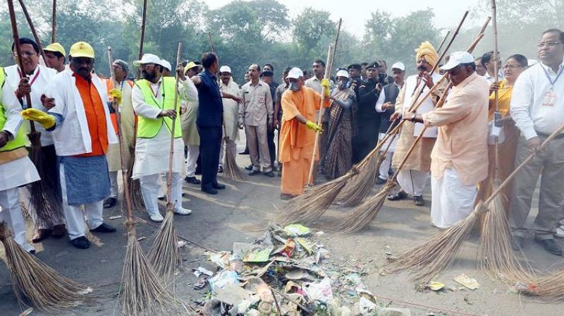 Adityanath, the first BJP chief minister of Uttar Pradesh to visit the Taj Mahal, entered from the western gate where he swept the road along with senior leaders. (Photo: Twitter/Yogi Adityanath)