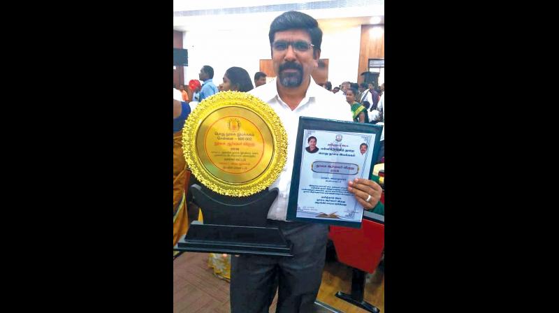 Dr B. Manivannan, who has been presented with Library Enthusiast Award.(Photo: DC)