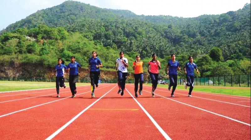 Athletes train on the 8-lane, 400 m synthetic track at Usha School of Athletics.