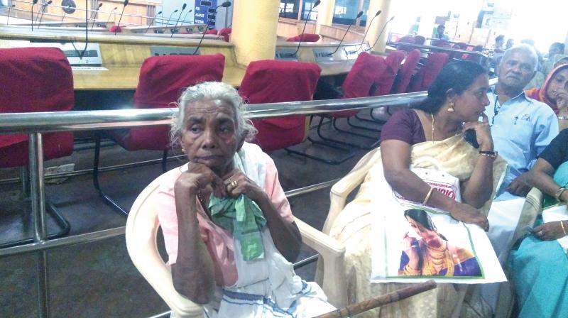 Bhavani K waits for her turn at the building adalat conducted by Thiruvananthapuram Corporation. (Photo: DC)