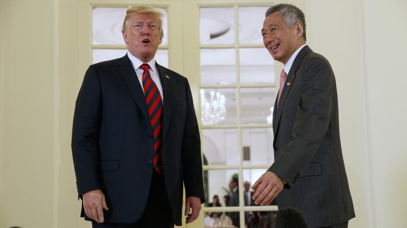 During the flight, the President spent time meeting with his staff, reading materials, and preparing for his meetings in Singapore. (Photo: AP)