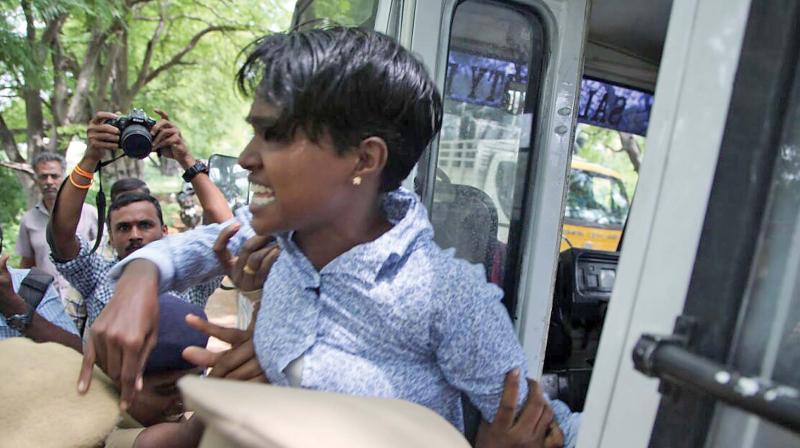 Valarmathi being taken away by police in Salem.	(Photo: DC)