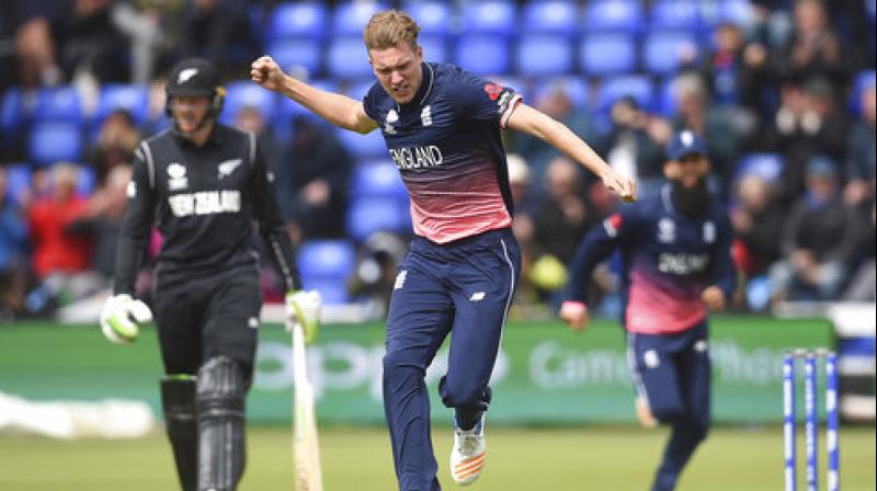 Englands Jake Ball celebrates taking the wicket of New Zealands Luke Ronchi, during the ICC Champions Trophy, Group A cricket match between England and New Zealand in Cardiff, Wales. (Photo: AP)