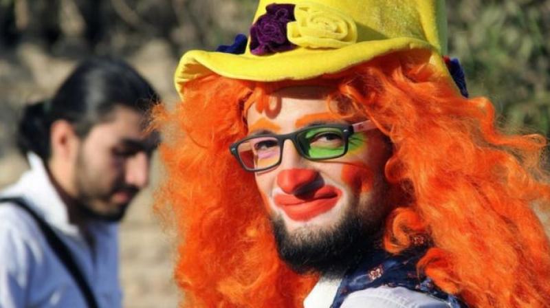 This undated photo courtesy of Ahmad al-Khatib, a media activist in Aleppo, shows Syrian social worker Anas al-Basha, 24, dressed as a clown, while posing for a photograph in Aleppo, Syria.  (Photo: AP)