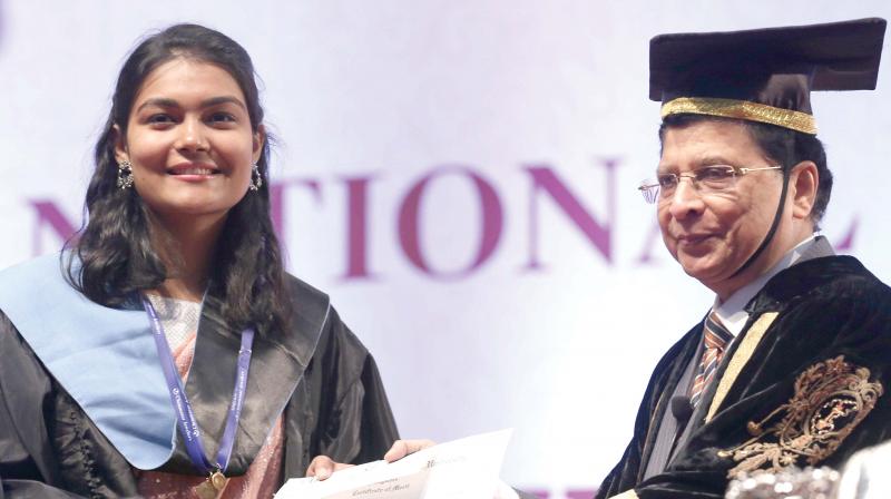 Chief Justice of India Dipak Misra presenting Certificate of Merit to the students during 26th Annual convocation of National Law School of India University at GKVK, in Bengaluru on Sunday (Photo: DC)