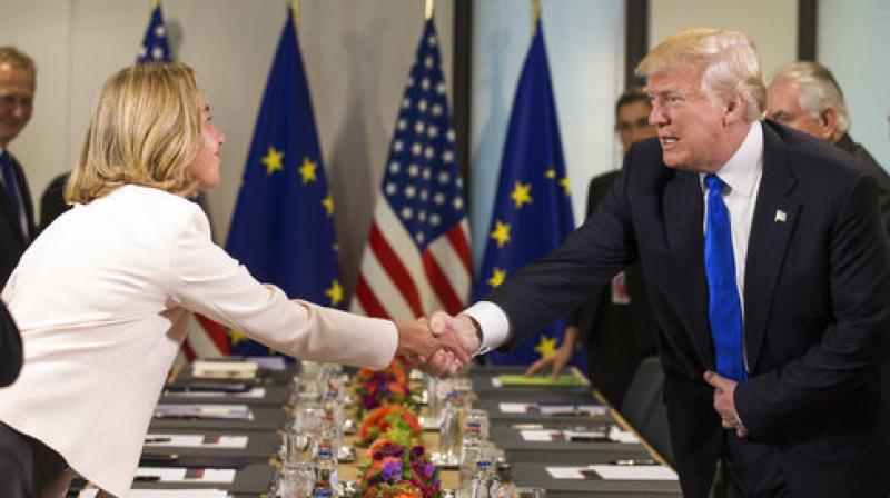 US President Donald Trump is welcomed by Federica Mogherini, the EU High representative for foreign policy, as they attend a meeting with US and EU leaders at the European Council in Brussels. (Photo:AP)