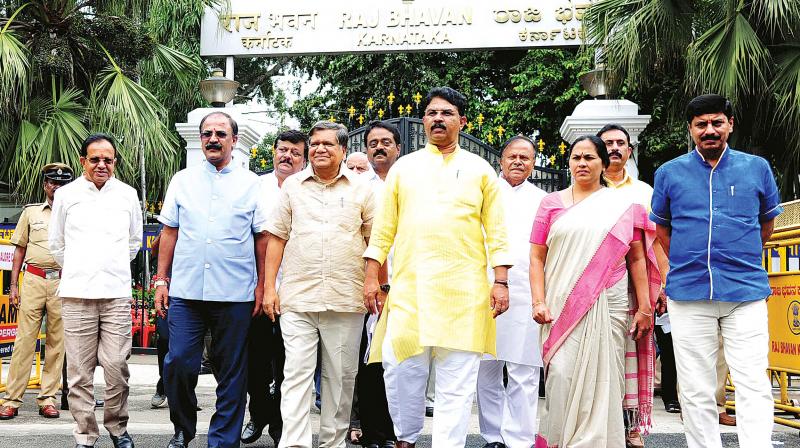 A BJP delegation led by opposition leader in the state Assembly Jagadish Shettar met Governor Vajubhai Vala on Friday and sought the disqualification of the MLCs involved in the TA/DA scam in BBMP