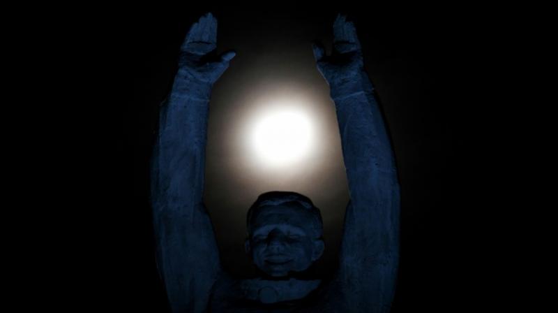 A statue of the first man in space, Russias Yuri Gagarin, reaching for the moon (Image: AFP) A statue of the first man in space, Russias Yuri Gagarin, reaching for the moon (Image: AFP)