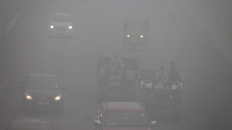 Vehicles move through dense fog at Delhi- Agra Highway in Faridabad on Thursday. (Photo: PTI)