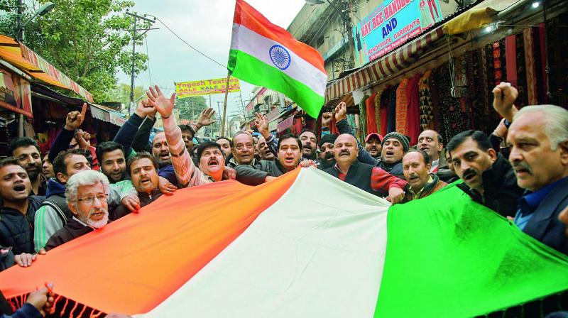 People chant slogans as they celebrate Indias major preemptive strike on JeMs camps in Jammu. (Photo: AP)