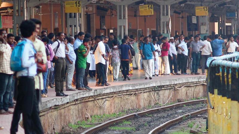 Distraught passengers at Kozhikode railway station platform after trains were late for hours following the derailment in Shornur.